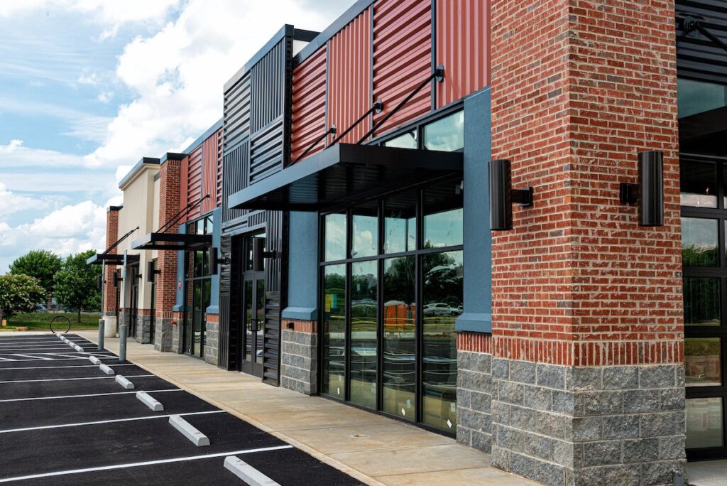Franchise shops in shopping mall parking lot